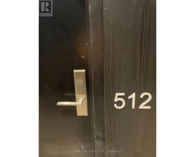 A door with a handle and a number 512 on the side.