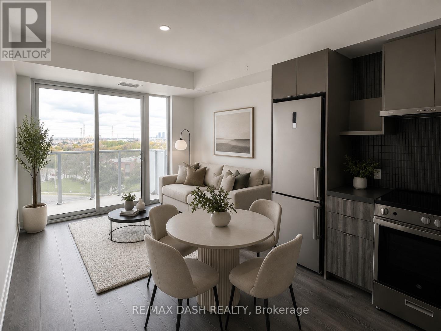A modern kitchen with a dining table and chairs.
