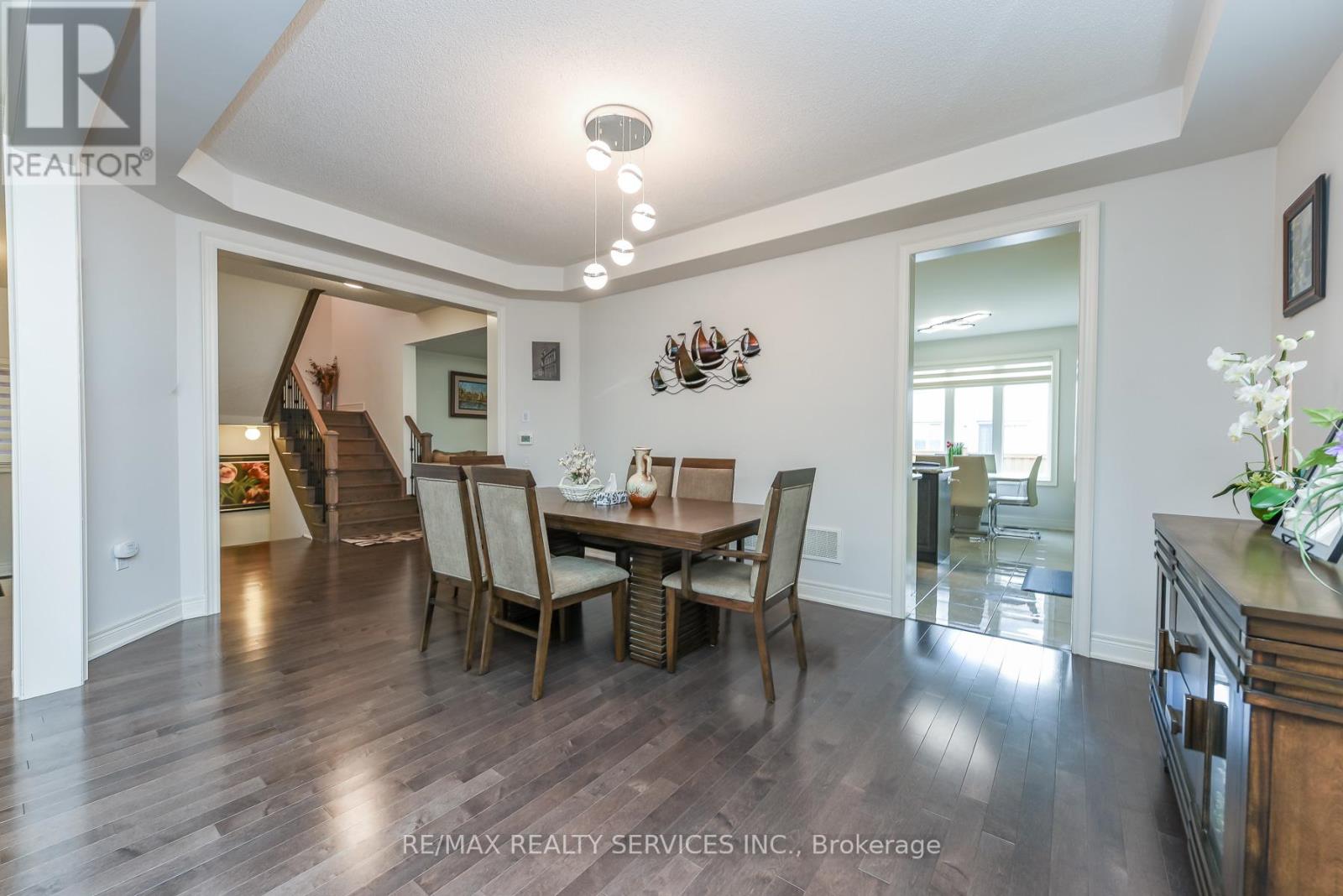 A dining room with a table set for four.