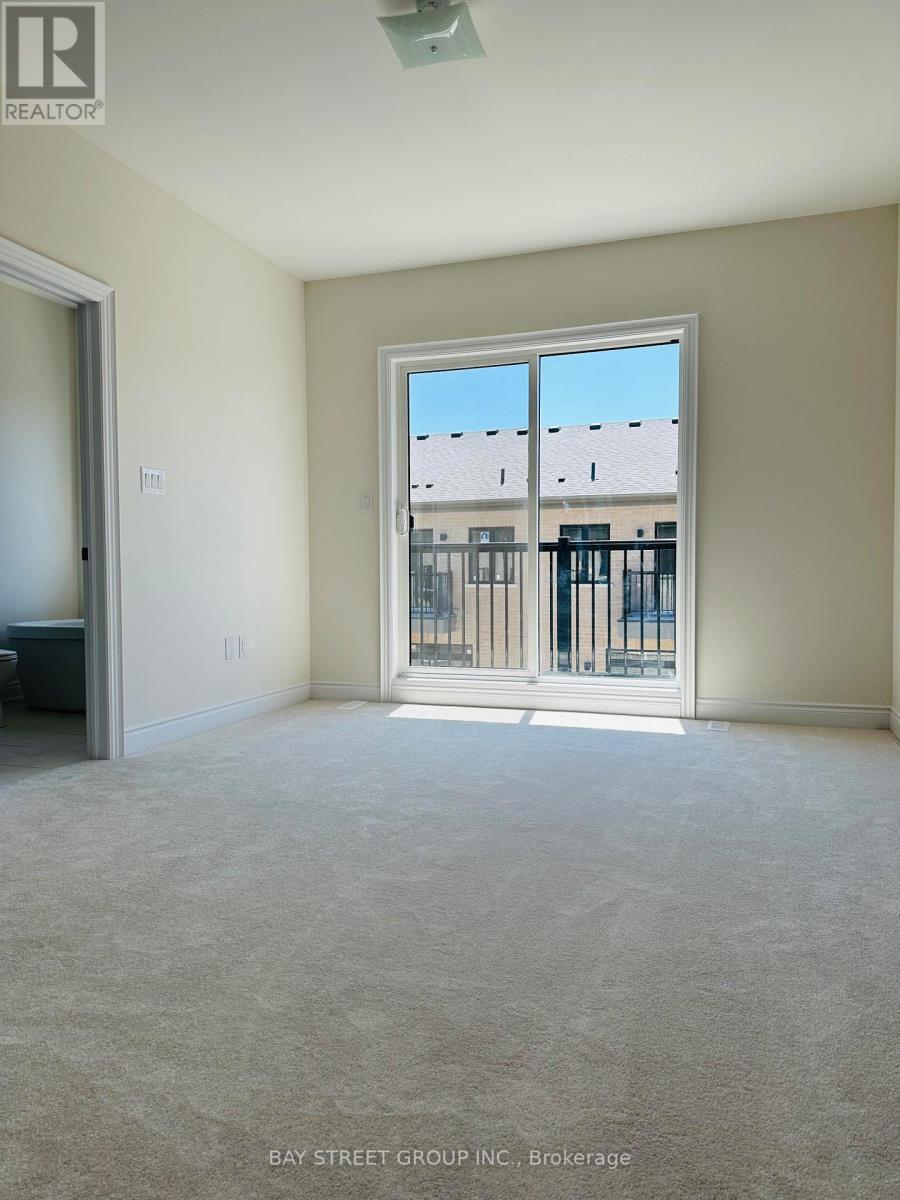 A room with a large window and a view of a building across the street.