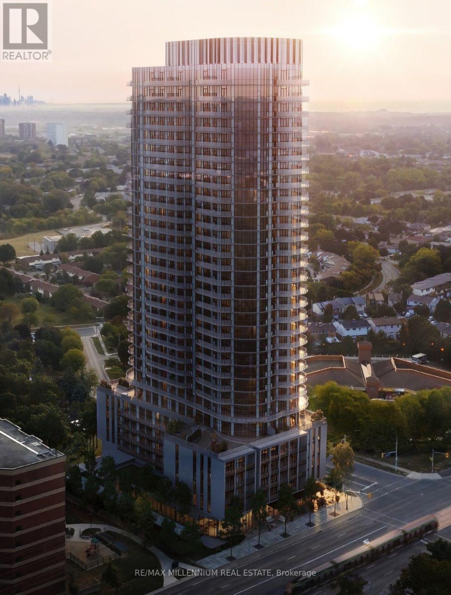 A tall building with a glass facade is the main focus of the image.