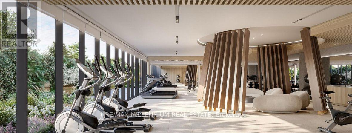 A gym with a row of stationary bikes and a row of treadmills.