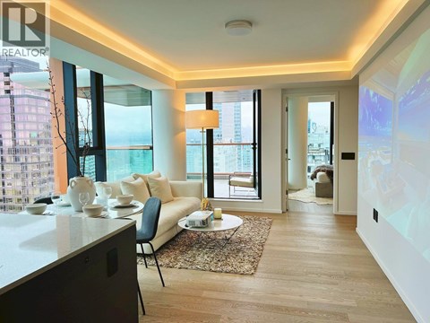 A modern living room with a white sofa and a glass table.