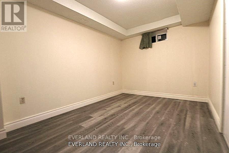 A room with Everland Realty Inc. written on the wall.