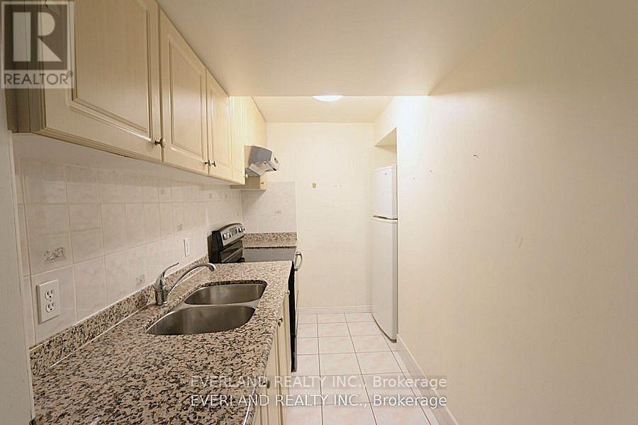 A kitchen with granite countertops and a sink.