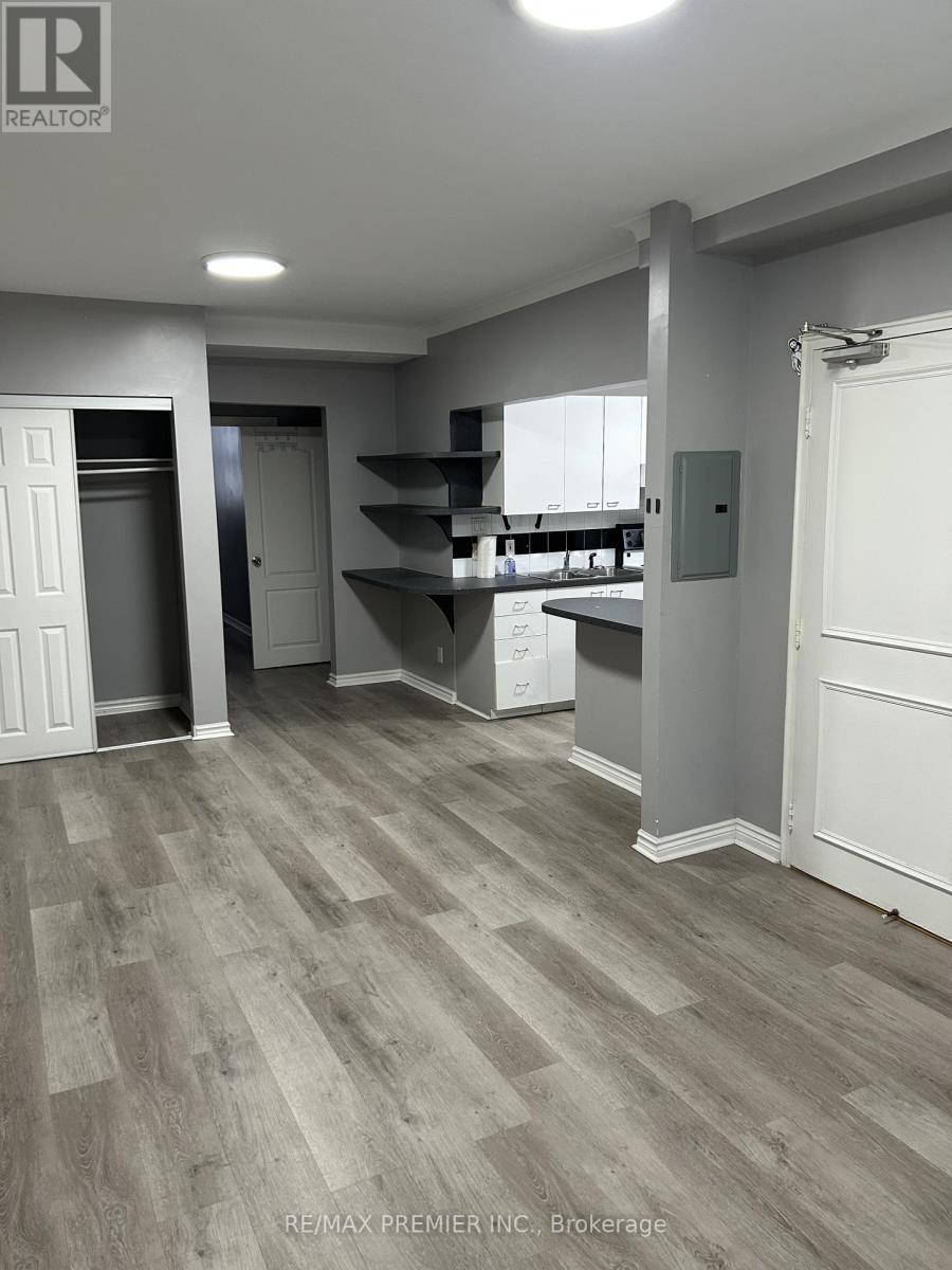 A room with a grey floor and white walls.
