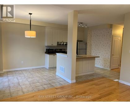 A kitchen with a countertop and cabinets is shown in this image.