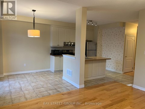 A kitchen with a countertop and cabinets is shown in this image.