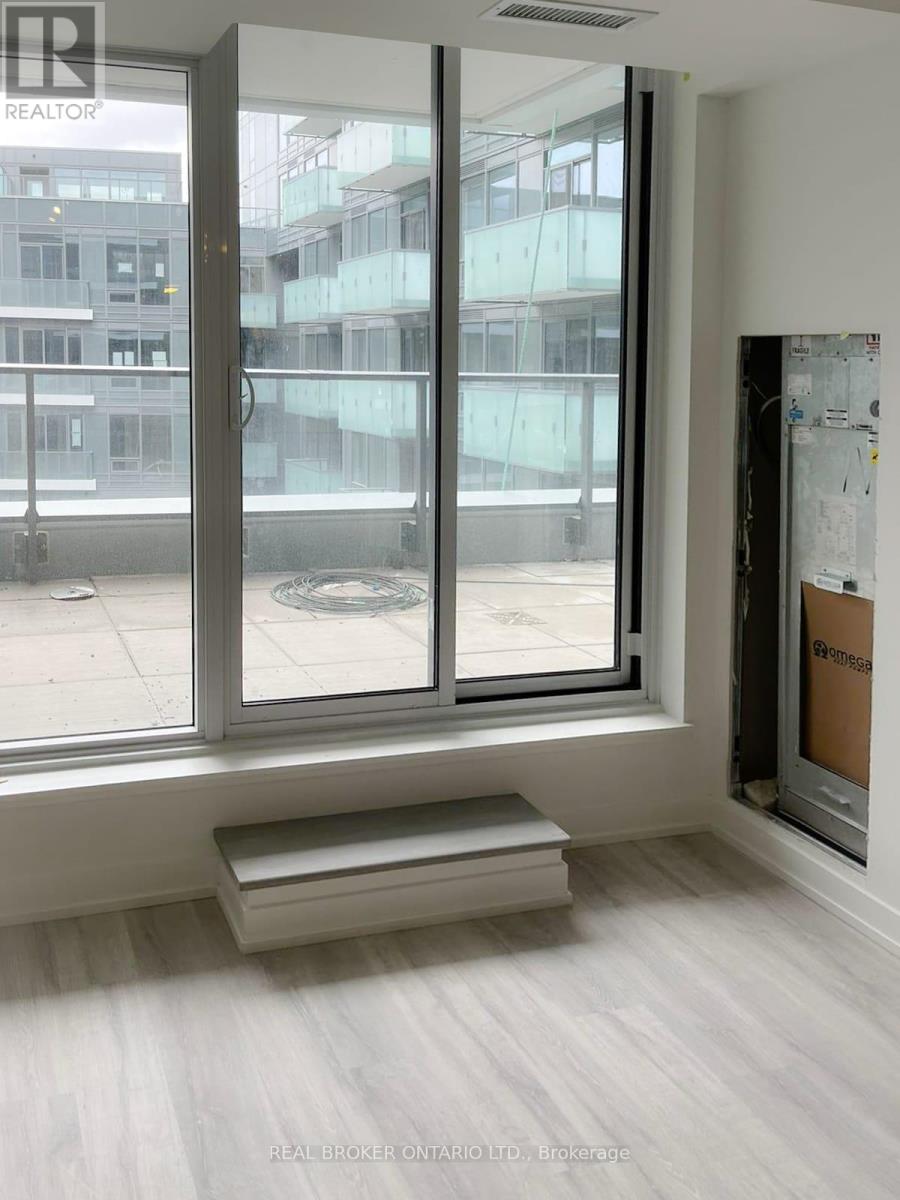 A real estate office with a large window overlooking a city street.