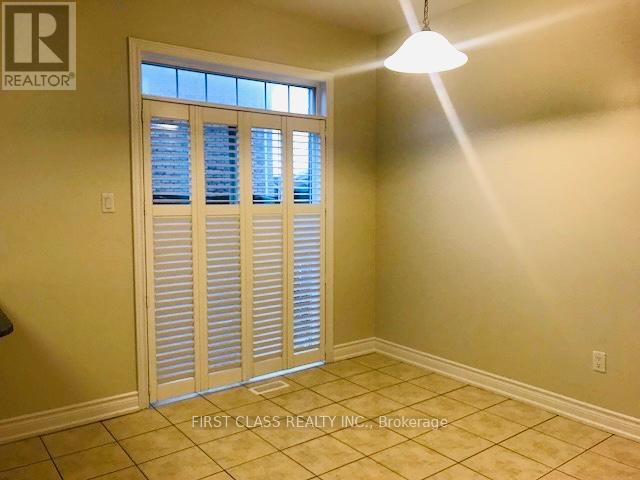 A room with a sliding door and a light on the ceiling.