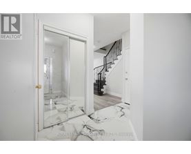 A room with a broken mirror on the floor.
