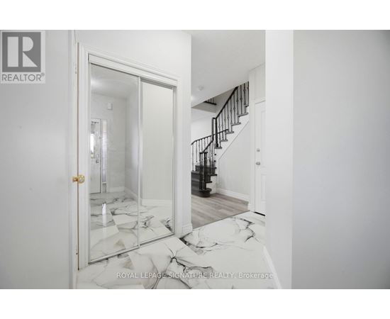 A room with a broken mirror on the floor.
