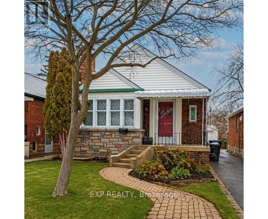 A house with a red door and a green roof is shown.