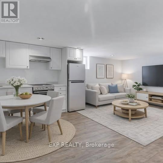 A modern kitchen with white appliances and a dining table set for four.