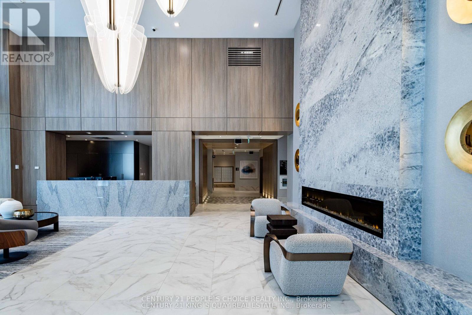 A modern living room with a fireplace and a large marble floor.