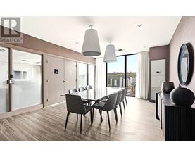A modern dining room with a glass table and chairs.