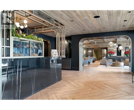 A modern interior space with a wooden floor and a glass wall.