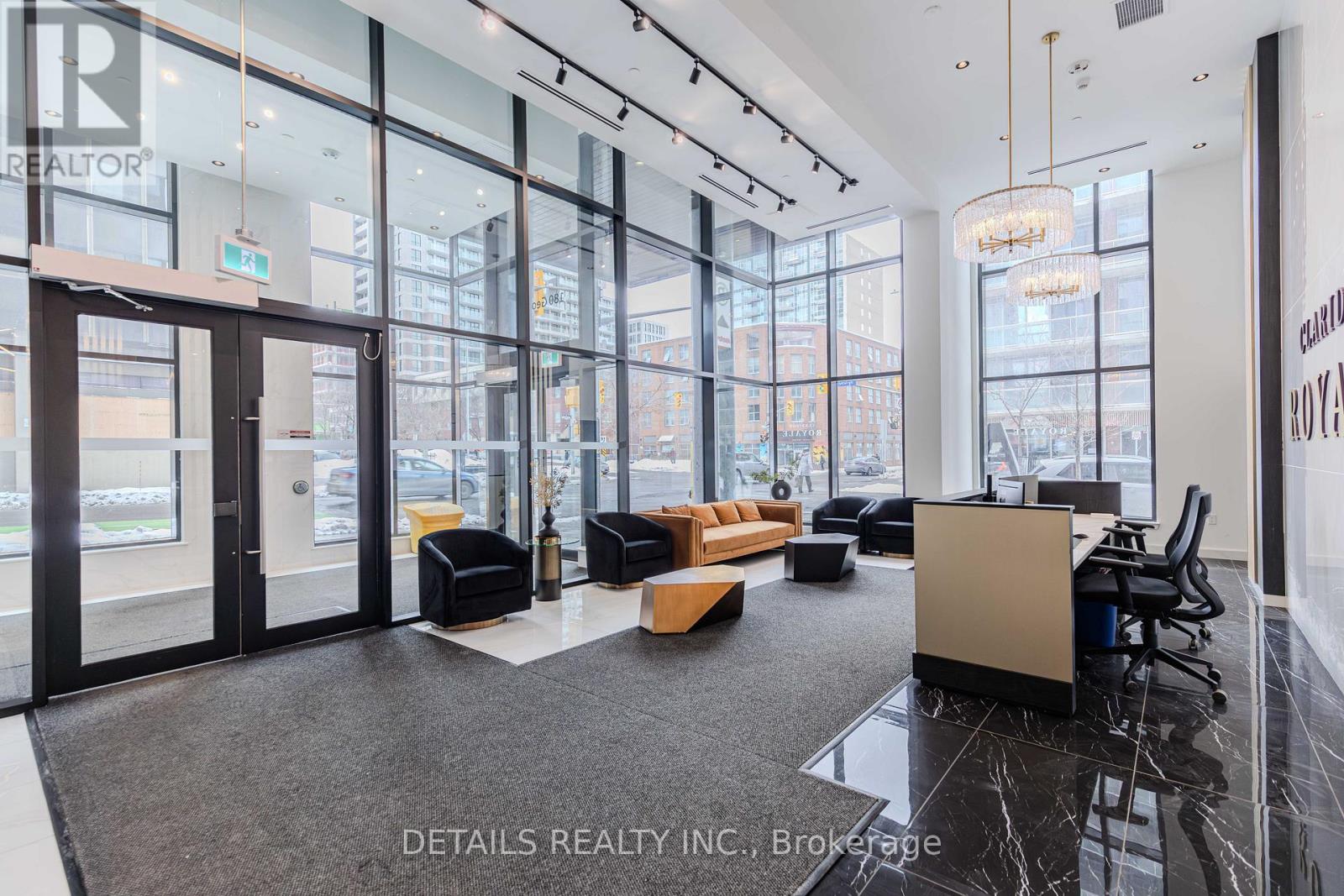 A modern office space with black and white decor and a view of the city.