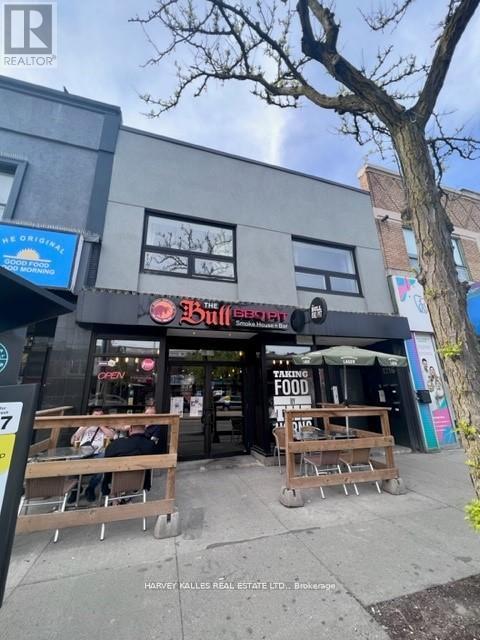 A street view of a restaurant named Bull's Head.