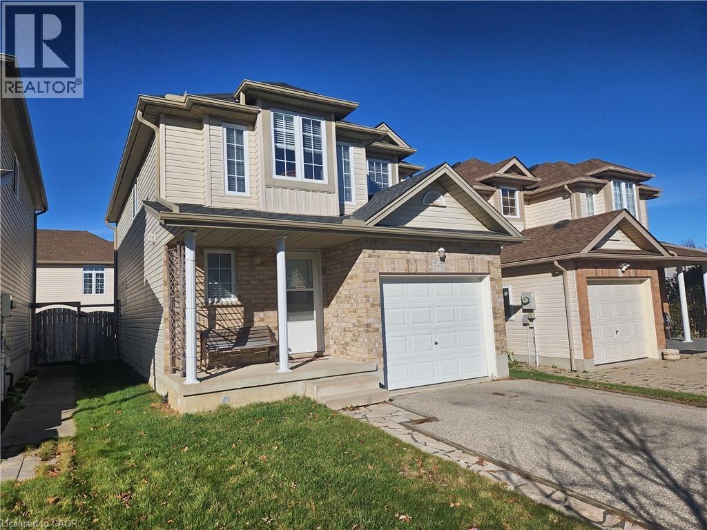 A house with a garage is for sale.