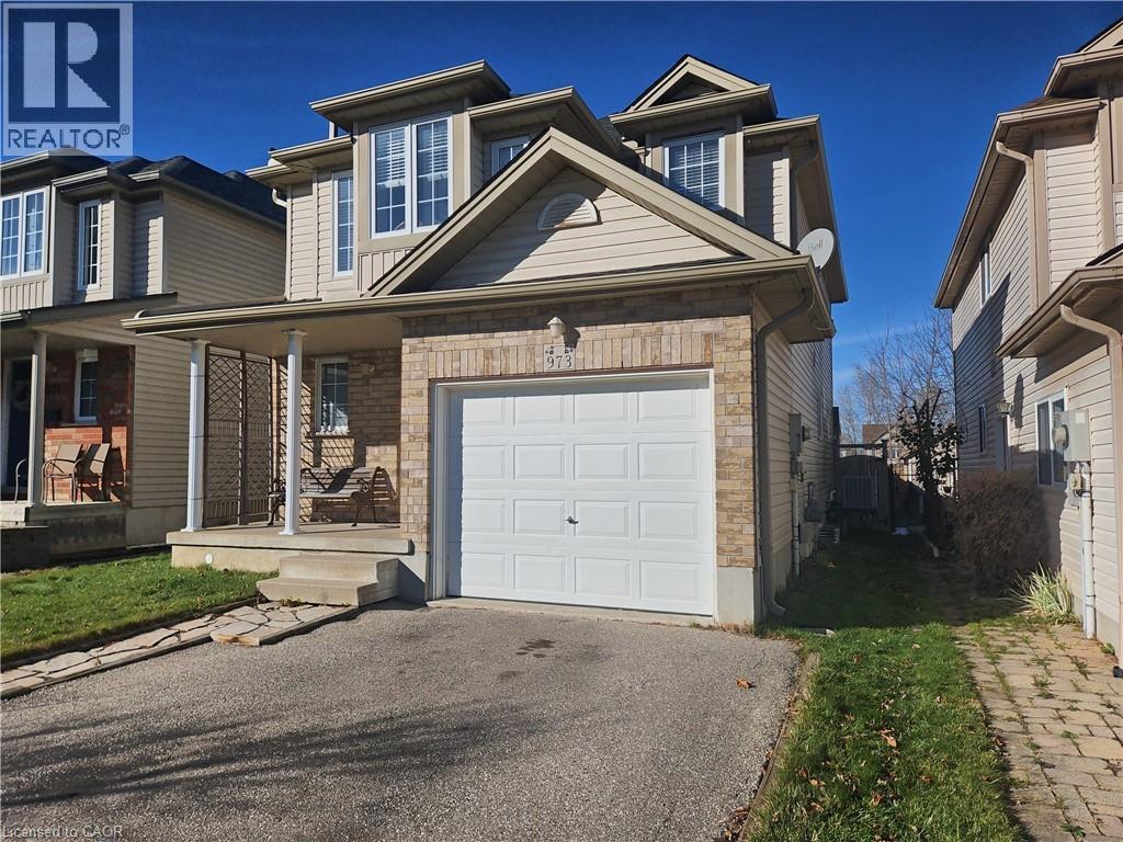 A house with a garage is for sale.