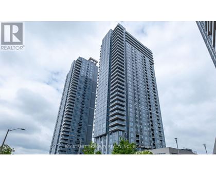 Two tall buildings with windows are seen in the image.