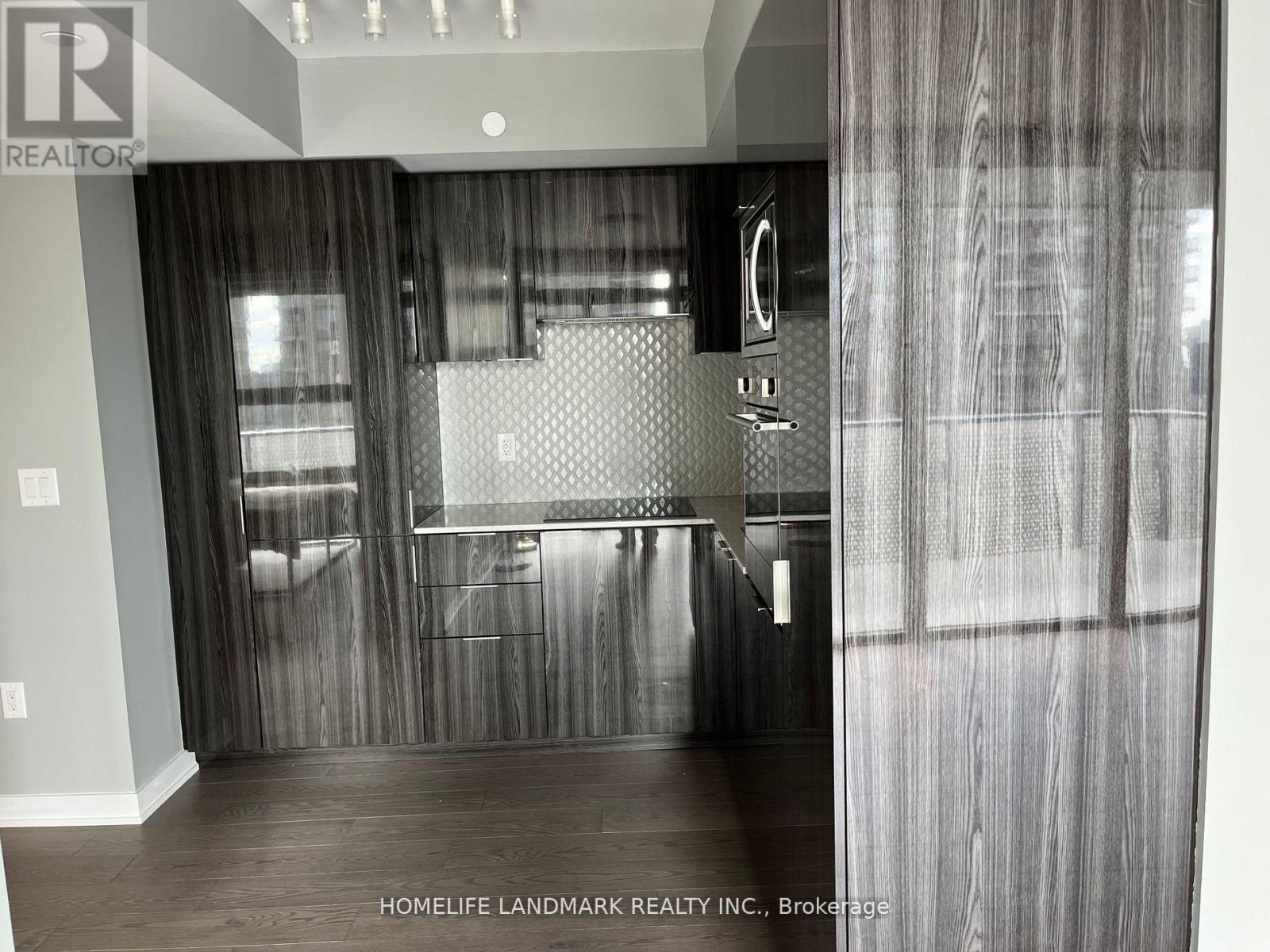 A bathroom with a walk-in shower and a toilet.
