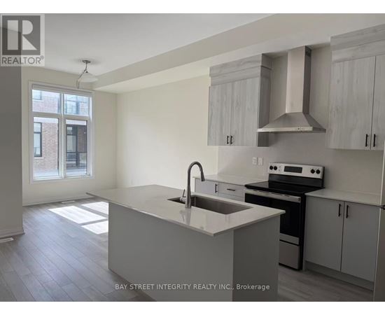 A kitchen with a sink and stove top oven.