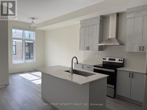 A kitchen with a sink and stove top oven.