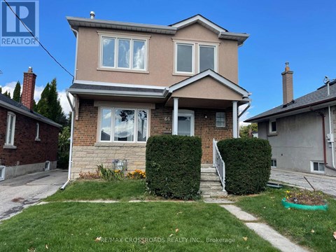 A house with a brown roof and a white window is for sale.