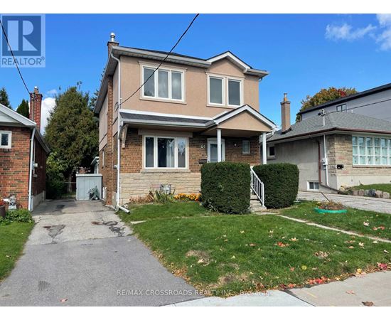 A house with a driveway in front of it.