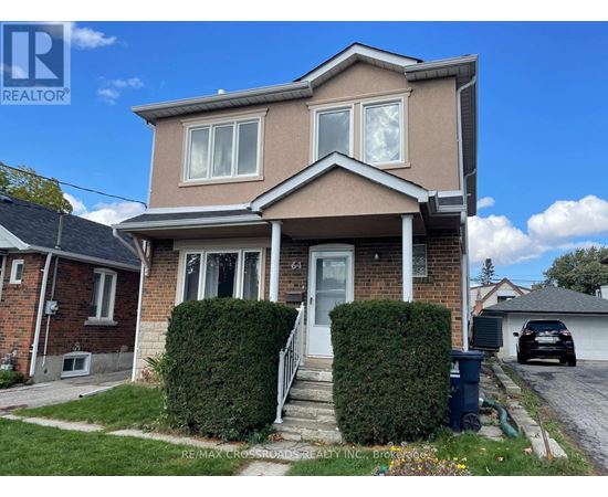 A house with a white door and windows is for sale.