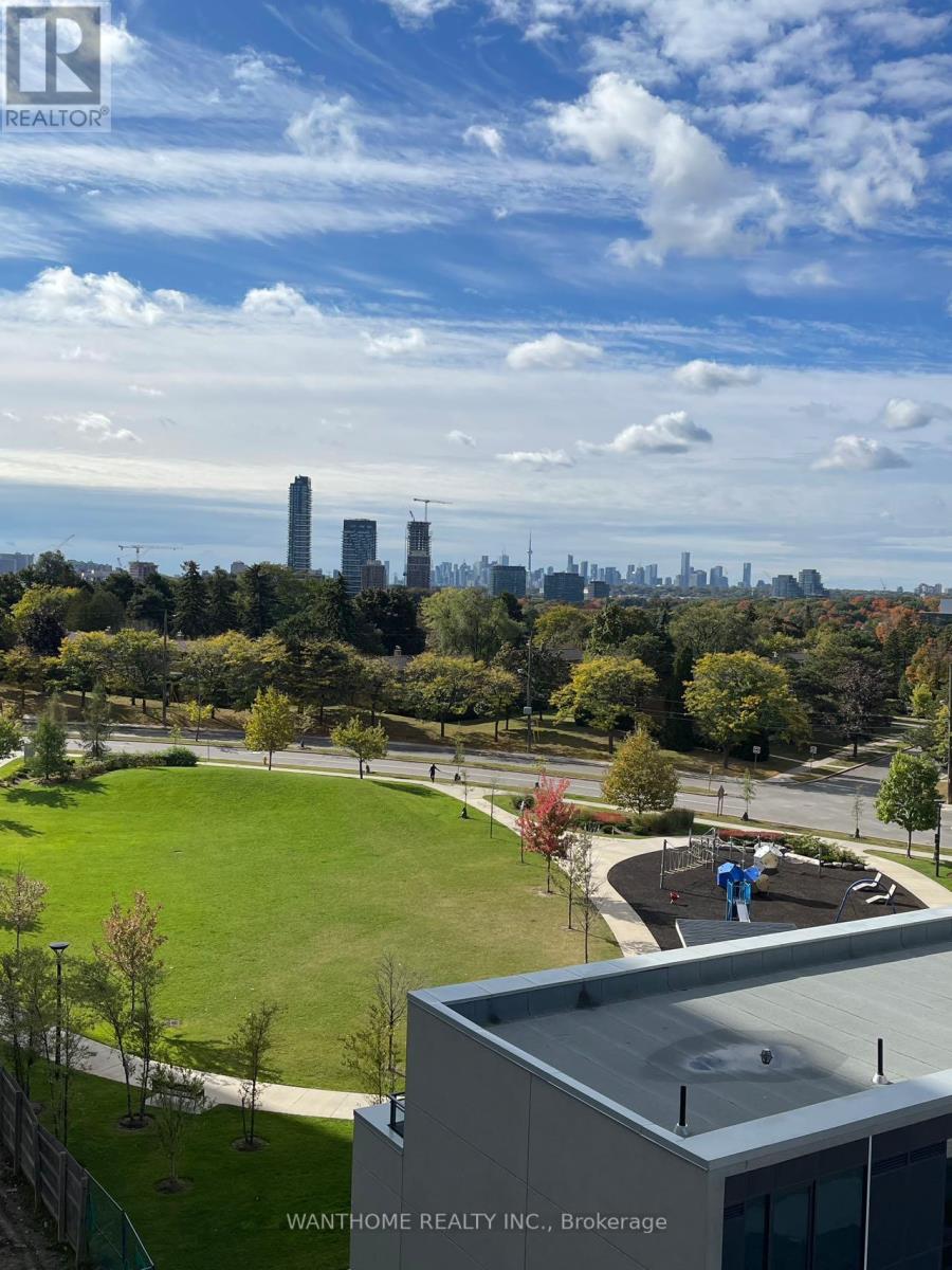 A real estate company's brokerage office overlooks a city skyline.