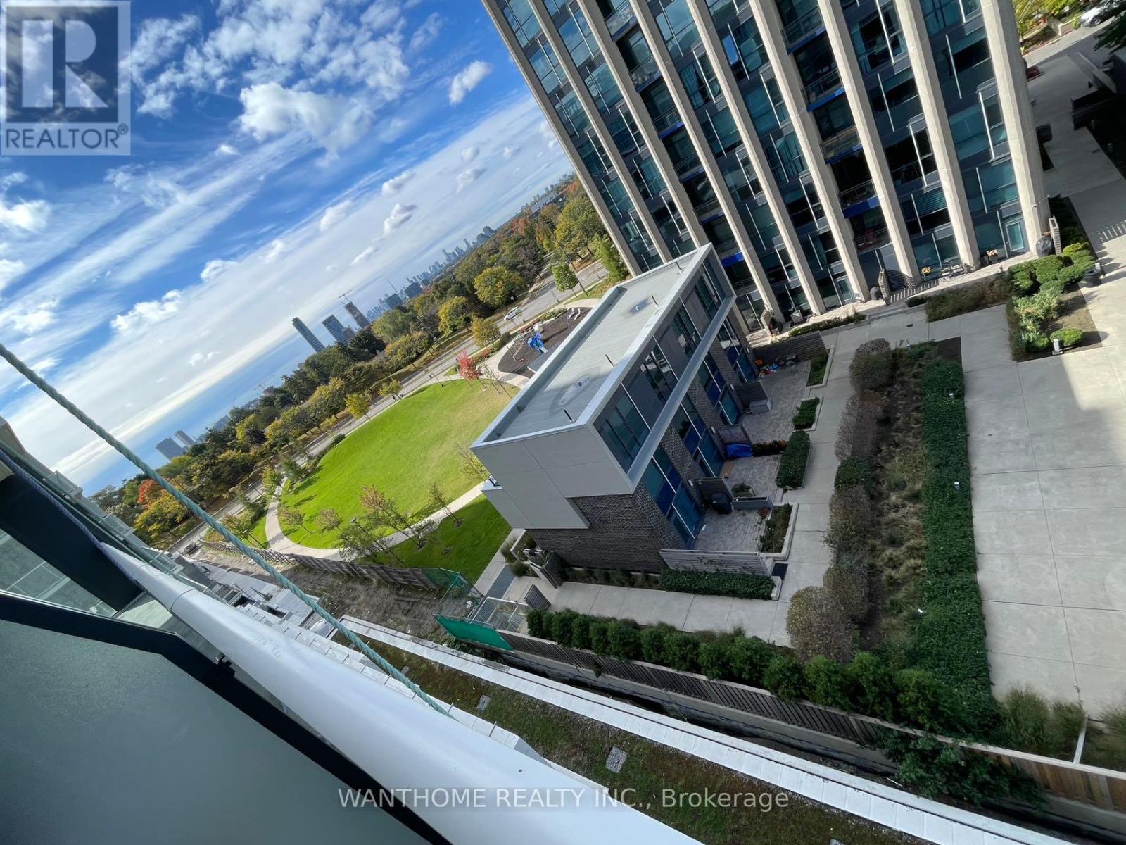A real estate company's logo is visible on a building in the distance.