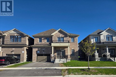 A row of houses with a REALTOR® logo in the foreground.