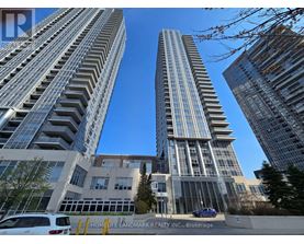 Two tall buildings stand next to each other with a Home Life Landmark Realty Inc. sign in the foreground.
