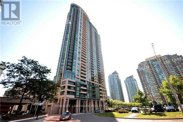A tall building with a curved facade is the main focus of the image.