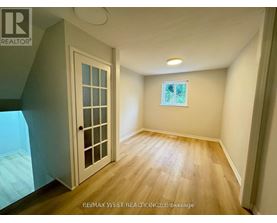 A room with a door and a window.