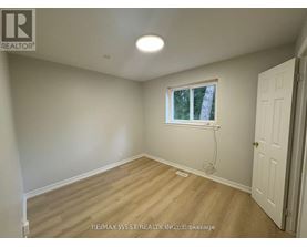 A room with a window and a door.
