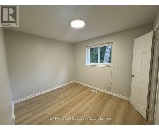A room with a window and a door.