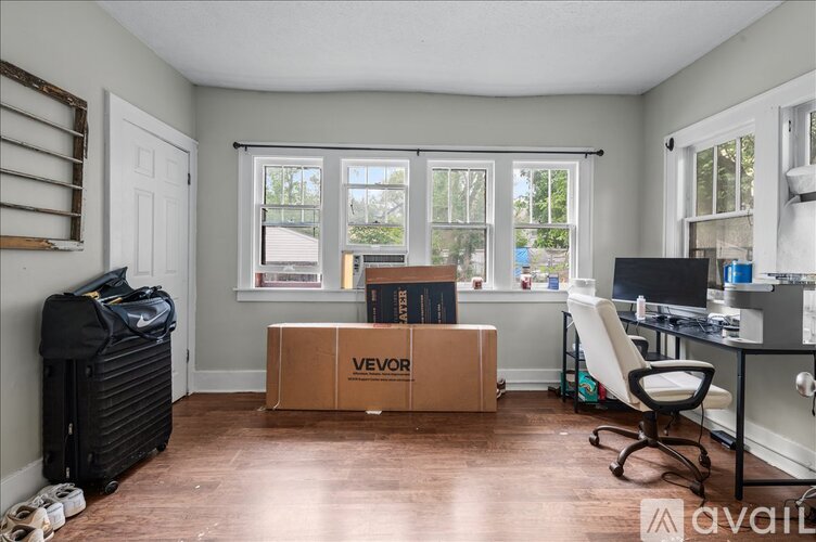 A kitchen with a sink and cabinets under a sign that says Home Sweet Home.