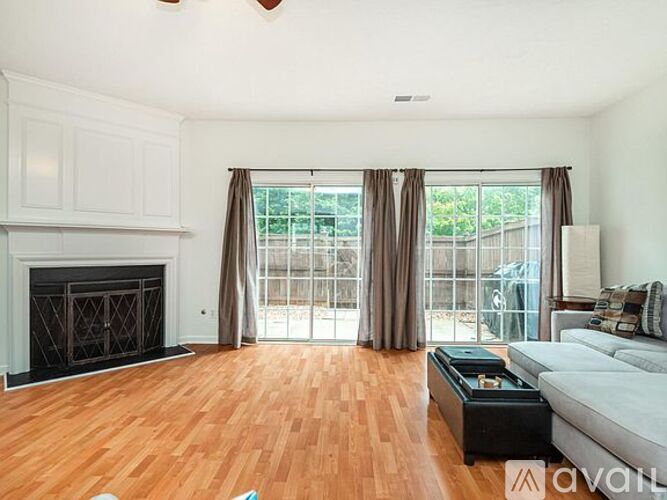 A living room with a fireplace and a couch.