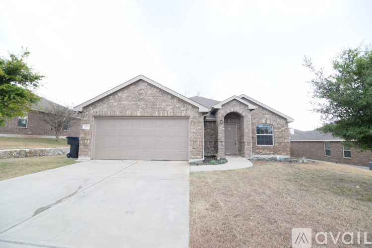 A house with a garage and a driveway.