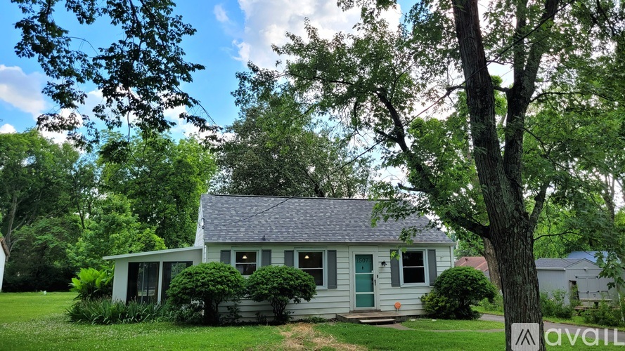 A house with a green door is for sale.