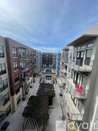 Apartment complex with a pool in the middle.