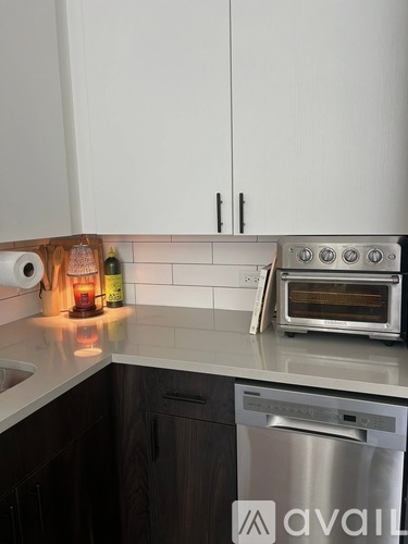 A kitchen with a stove, oven, and dishwasher.