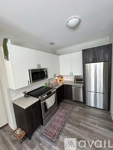 A kitchen with a stove top oven and a microwave.