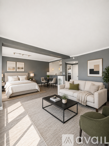 A modern living room with a white sofa, a bed, and a coffee table.