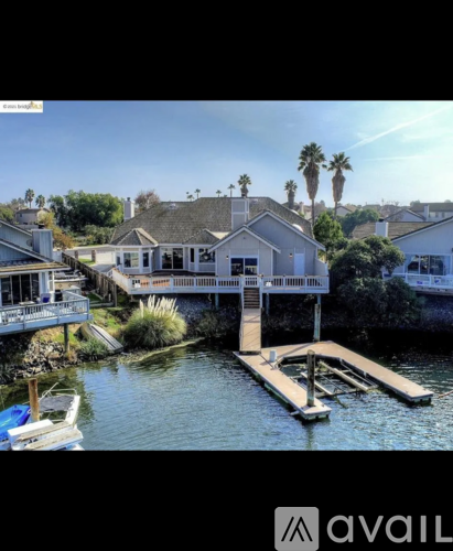 A house with a dock in front of it.
