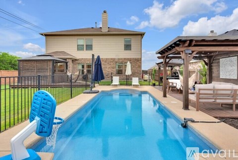 A house with a pool in the backyard.